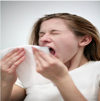 woman sneezing cold and flu