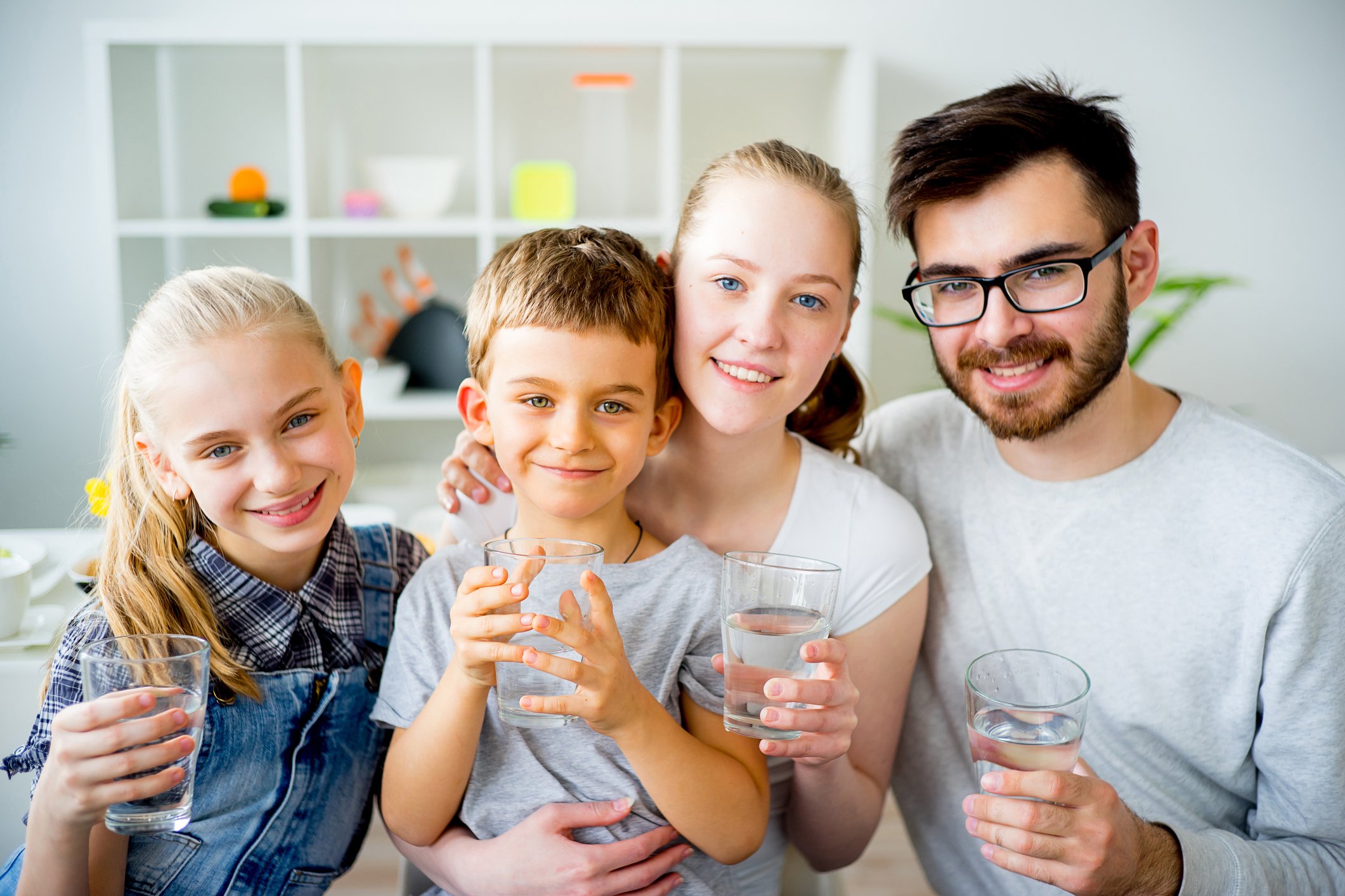 family drinking water at home