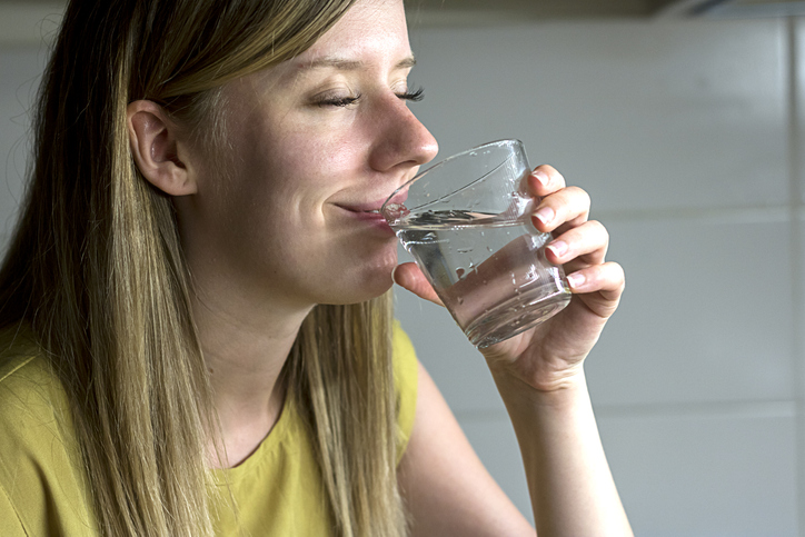 woman enjoying purified water